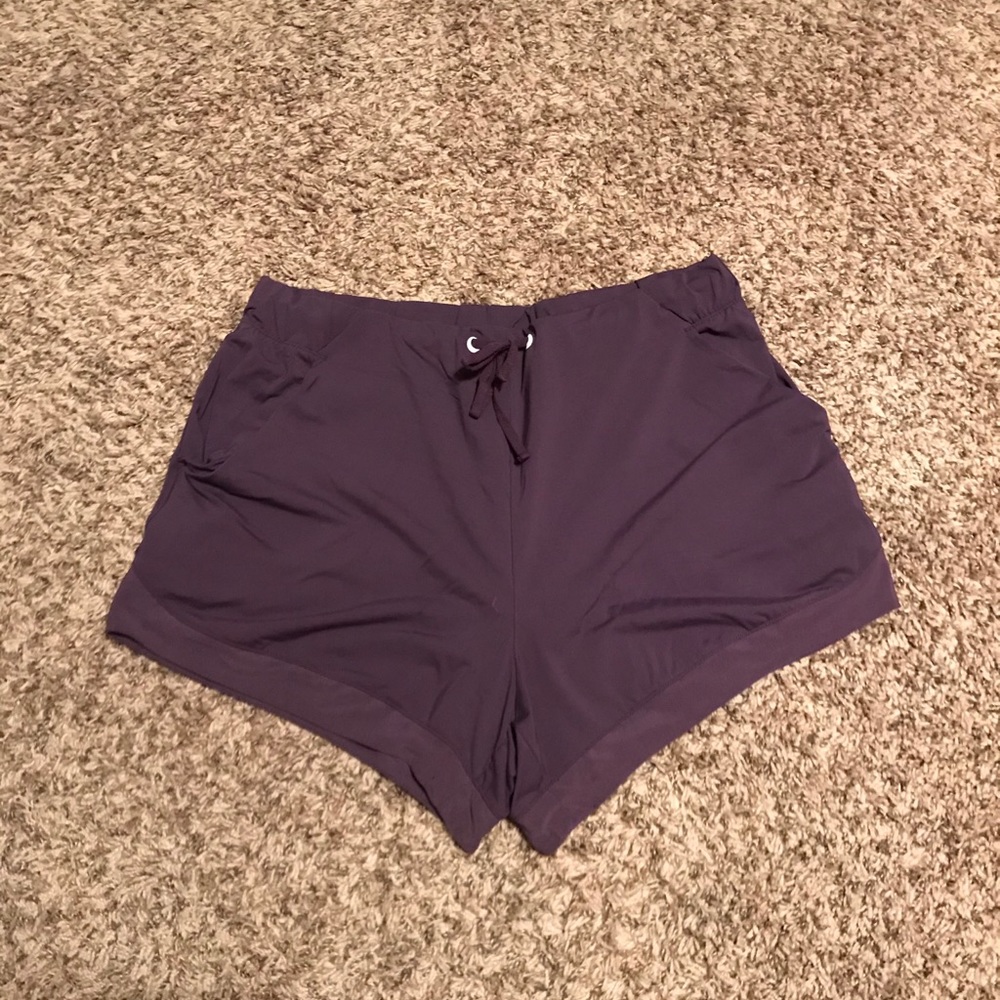 Purple active shorts with mesh detail.